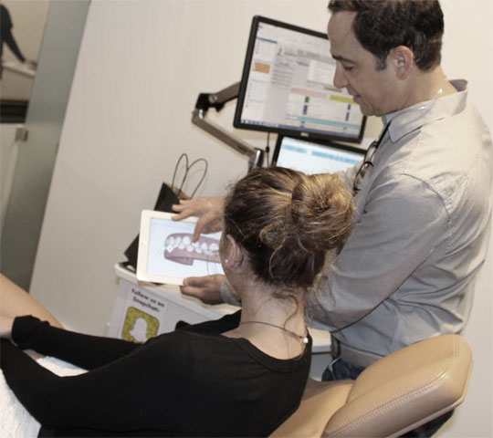 Dr. Kunik congratulating patient.