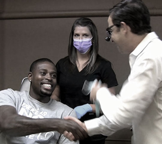 Dr. Kunik congratulating patient.